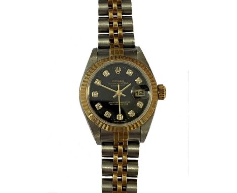 circa 1999, model number 79173, serial number A854279, the signed circular black diamond point dial, 20mm diameter, with gold