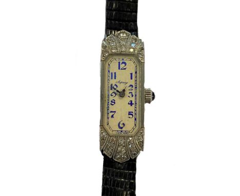 circa 1920, the signed cut corner rectangular cream coloured dial, 9mm diameter, with blue Arabic numerals, blued hands and b