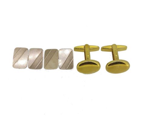 first, of oval form with plain polished finish, 17.2 x 12.1mm, bar and hinged fitting, unhallmarked, stamped '585', weight 12