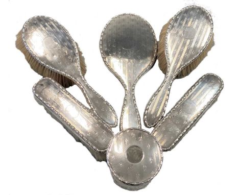 comprising hand mirror, two clothes brushes and a hairbrush, mark of Henry Charles Freeman, Birmingham 1908/9, a further hair