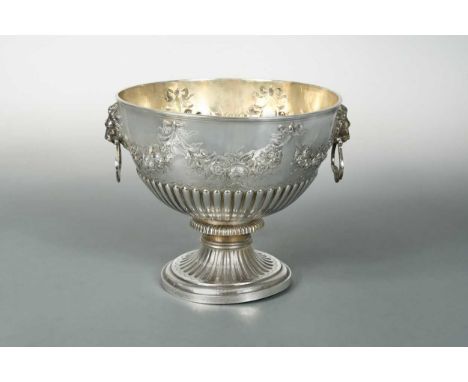 mark of Robert Harper, London 1879, of circular form, lower half gadrooned, upper half decorated with repoussé foliate and ri