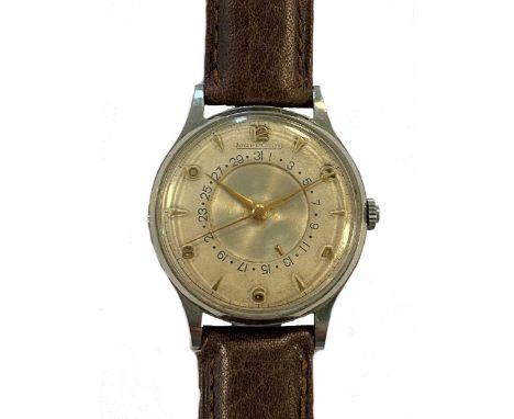 circa 1953, model 2777, the signed circular cream coloured dial, 30mm diameter, with gold coloured alternate batons and Arabi
