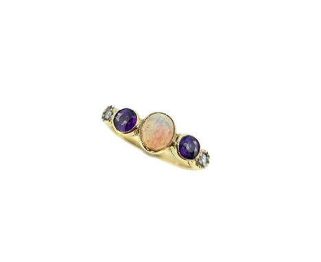 rubover set central oval shaped cabochon opal, 6.2 x 5.3mm, flanked by two round faceted amethysts, approximate diameter 4mm,