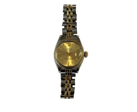 circa 1970, model number 6517, serial number 2375475, the signed circular champagne dial, 20mm diameter, with gold coloured h