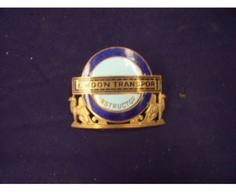 Gilt metal and enamel London Transport Instructors cap badge 