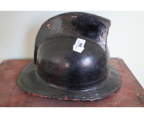Vintage French leather and canvas fireman's helmet in black finish, complete with liner 