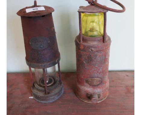 Newcastle Upon Tyne miners lamp no.291 and another miners type lamp with brass plaque no.791 base marked Oldam patent (2) 