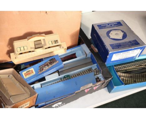 Box containing a quantity of Hornby Dublo railway including controller units, station, various three rail ballast track, good