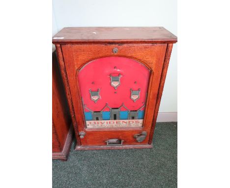 Vintage oak cased penny arcade pinball type machine 'Dividends' (50.5cm x 24cm x 69cm) 