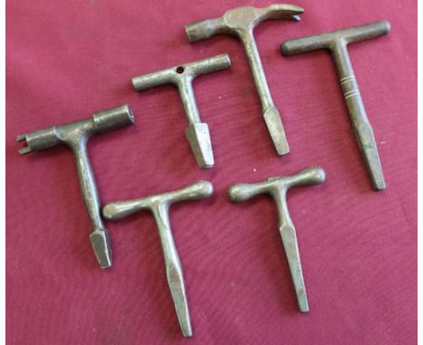 Collection of six railway door keys and combination tools, one with a claw hammer head, various markings including GWR, BR (E