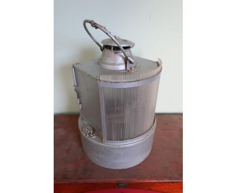 Unusual D shaped railway lamp interior with circular reservoir base 