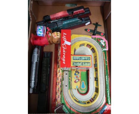Selection of railway model locomotive displays, tin plate monkey playing drum and a tin plate lift garage etc 