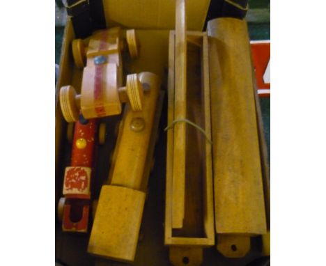 Wooden model train with two carriages, another wooden painted train and a wooden racing car 