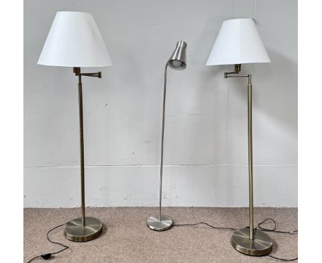A pair of metal reading lamps with adjustable arms, 129 cm, and another reading light, (3).&nbsp;