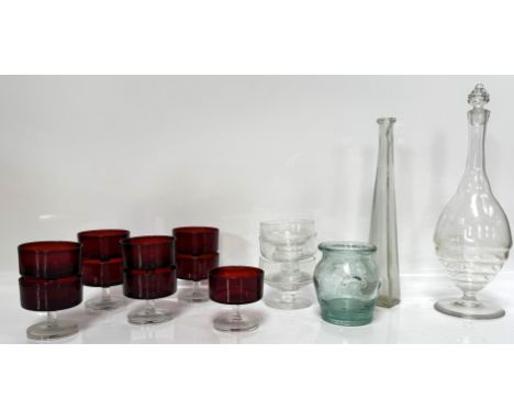 A footed glass decanter of bottle form, 37 cm, also coloured glass bowls, (A lot).&nbsp;