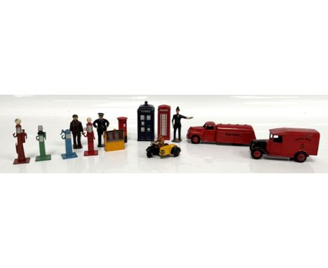 A collection of toy automobiles and associated, to include, Dinky Petrol truck, Police Box, petrol pumps, an AA motorcycle, (