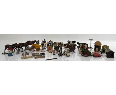 A collection of vintage cast metal and plastic toys, mostly farmyard related, including Britains, cows, horses, cats, hay sta