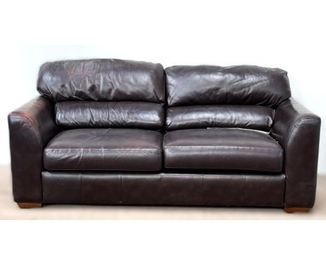A two seater leather sofa bed, 93 x 196 x 100 cm.