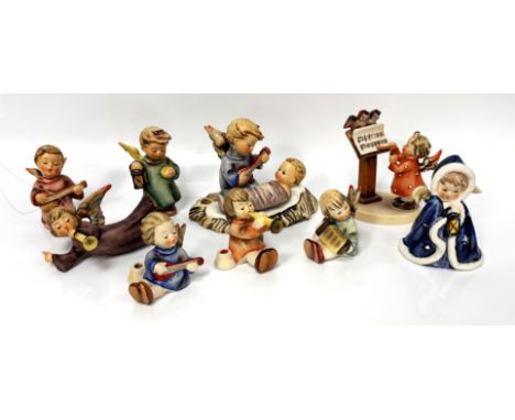 A Collection of Hummel figures to, to include; the Christ child in manger, 10cm, and other angles, (9).