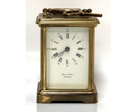 A carriage clock inscribed Bornand Freres Montbeliard, 11cm.