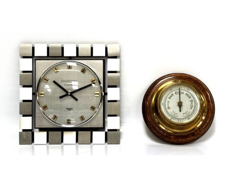 A mid-century Bravingtons Renown wall clock, marked made in Germany, 25 x 25 cm, and a wall barometer, (2).