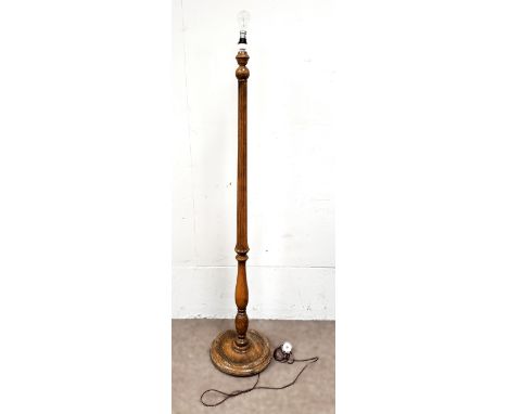 A standard lamp with fluted stem on dished base, 155 cm.