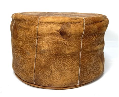 A vintage leather pouffe with camel to centre, please note this item is stuffed with newspaper, 30 x 50 cm.