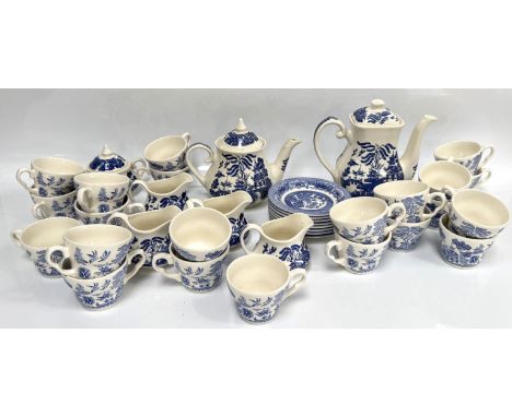 A large blue and white willow pattern dinner service to include; tea pots, coffee pots, dinner plates, bowls, side plates, sa