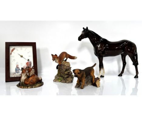A Beswick horse, 28 cm, three other animal figures and a hunt themed clock, (5).
