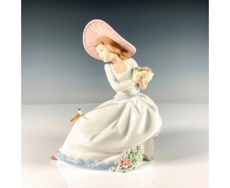 Glossy finish lovely figure featuring a young lady sitting peacefully arranging the basket of fresh flowers she just picked w