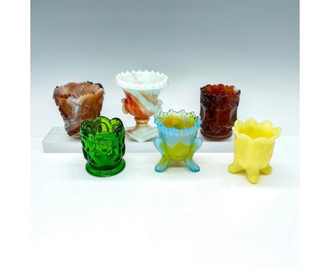 This glass grouping includes slag glass, vintage emerald-green glass, uranium glass, and Degenhart. Largest piece measures 3.