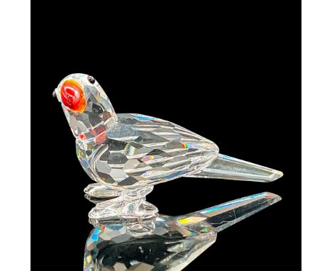 This parrot has a faceted clear crystal body and with a stunning Fire Opal beak. Swarovski etched backstamp. This item has it