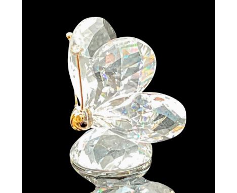 This version has gold antenna with a large gold nose which covers most of the face and resembles a mask. It has black eyes, a