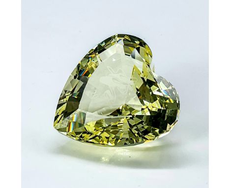 Lead crystal yellow figure heart with ballet shoes and the year 2004 etched inside. This piece was released during the launch