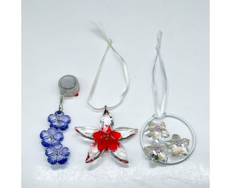 The Swarovski grouping includes violet colored flower window ornament, SCS 2013 spring blossom ornament, and a poinsettia orn