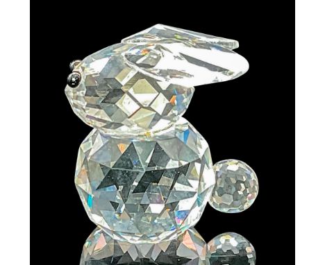 This rare bunny in faceted clear crystal features jet black eyes. This variation has ears that lie flat on the top of his hea