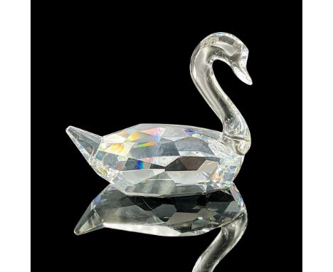 This Swarovski crystal flirting swan was part of the Feathered Beauties collection. Made in faceted clear crystal. The neck a