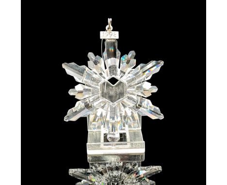 Star shaped crystal snowflake designed for annual ornament, created with 12-points. Blue satin ribbon included for hanging. S