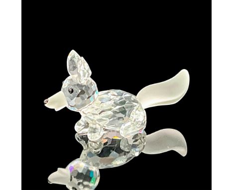 A clear faceted body of a fox running, with a frosted tail. Swarovski etched backstamp. This item has its original box which 