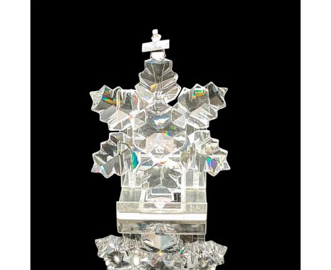 Clear faceted crystal annual ornament created with thicker flake design. Blue satin ribbon included for hanging. Swarovski ba