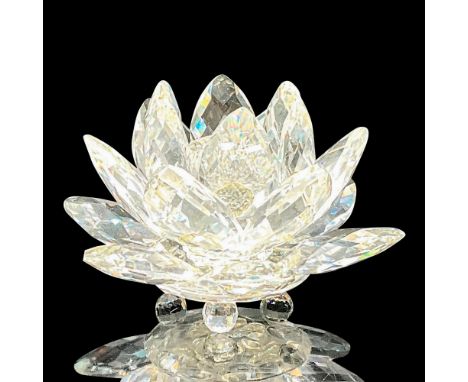 The Swarovski Waterlily Candleholder is a clear crystal candleholder shaped like a multi-petal waterlily, featuring crystal b