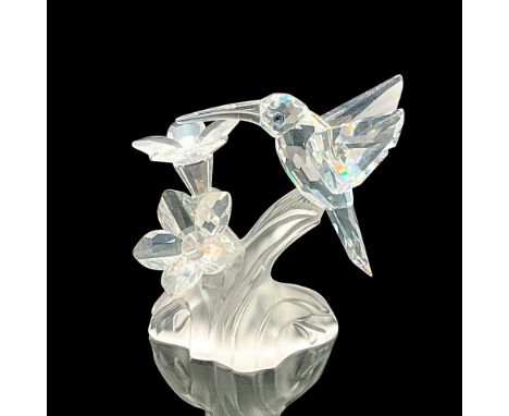 This hummingbird was part of the Feathered Beauties theme. The hummingbird and flowers are made from clear crystal, eyes are 