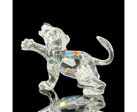 Lead crystal figure baby lion that was part of the African Wildlife collection. Swarovski etched backstamp. Includes Swarovsk