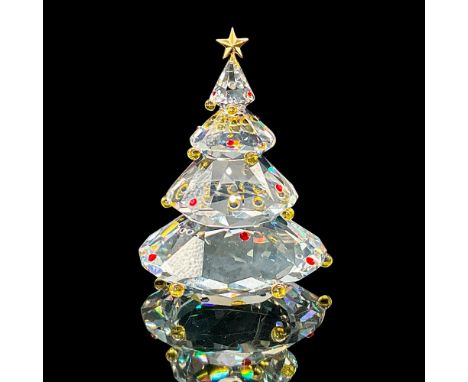 This tree was in the Cheerful Times group. The tree is topped with a metal star and has colored crystal ornaments on it. Swar