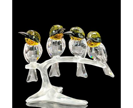 This Swarovski crystal set of 4 bee-eaters, part of the Feathered Beauties collection, symbolizes unity on a clear crystal br