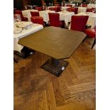 A bespoke Robert Angell Churchill dining table the oak top mounted above a shaped square pedestal