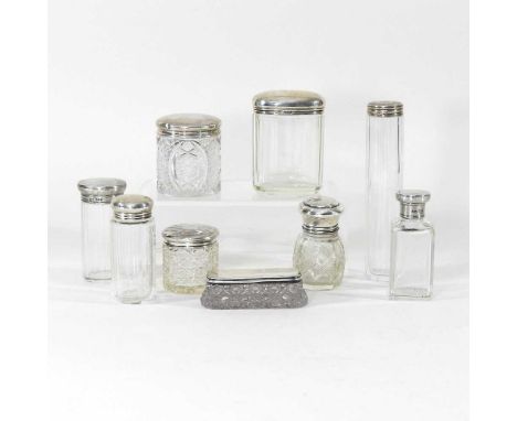 A collection of early 20th century and later silver top dressing table jars, highest 17cm (9)Dirty. Largest cut glass jar, as