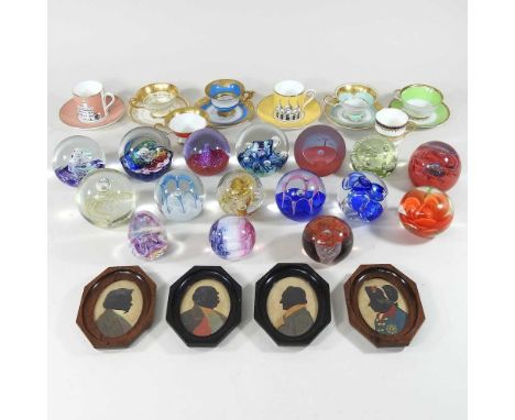 A collection of art glass paperweights, to include Caithness, together with various coffee cups and saucers and four silhouet