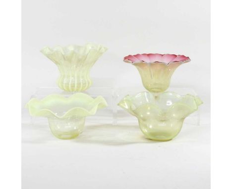 A collection of four vaseline oil lamp shades, one with a pink frilled edge, 9cm high (4)Generally dirty, with light surface 