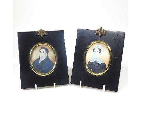 English school, 19th century, a miniature portrait of a seated gentleman, oil on ivory, 7 x 6cm, together with another of his